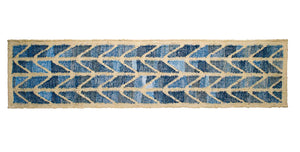 Coastal style upcycled denim blue and sustainable jute table runner in herringbone pattern.