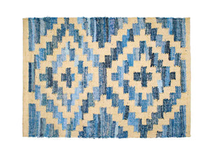 Coastal style upcycled denim blue and sustainable jute door mat in Aztec pattern.