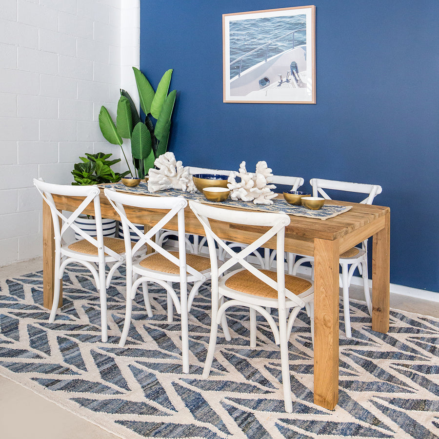 Coastal style upcycled denim blue and white cotton flatweave rug in herringbone pattern.
